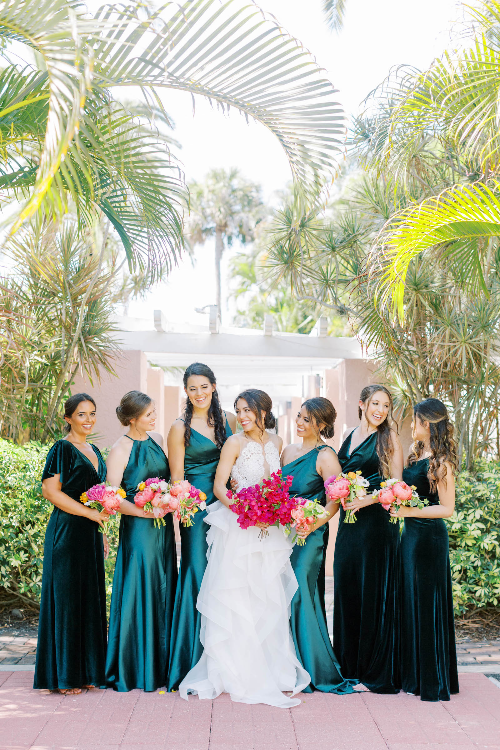 Vibrant Pink Wedding Bouquets with Mismatched Emerald Bridesmaids Dresses