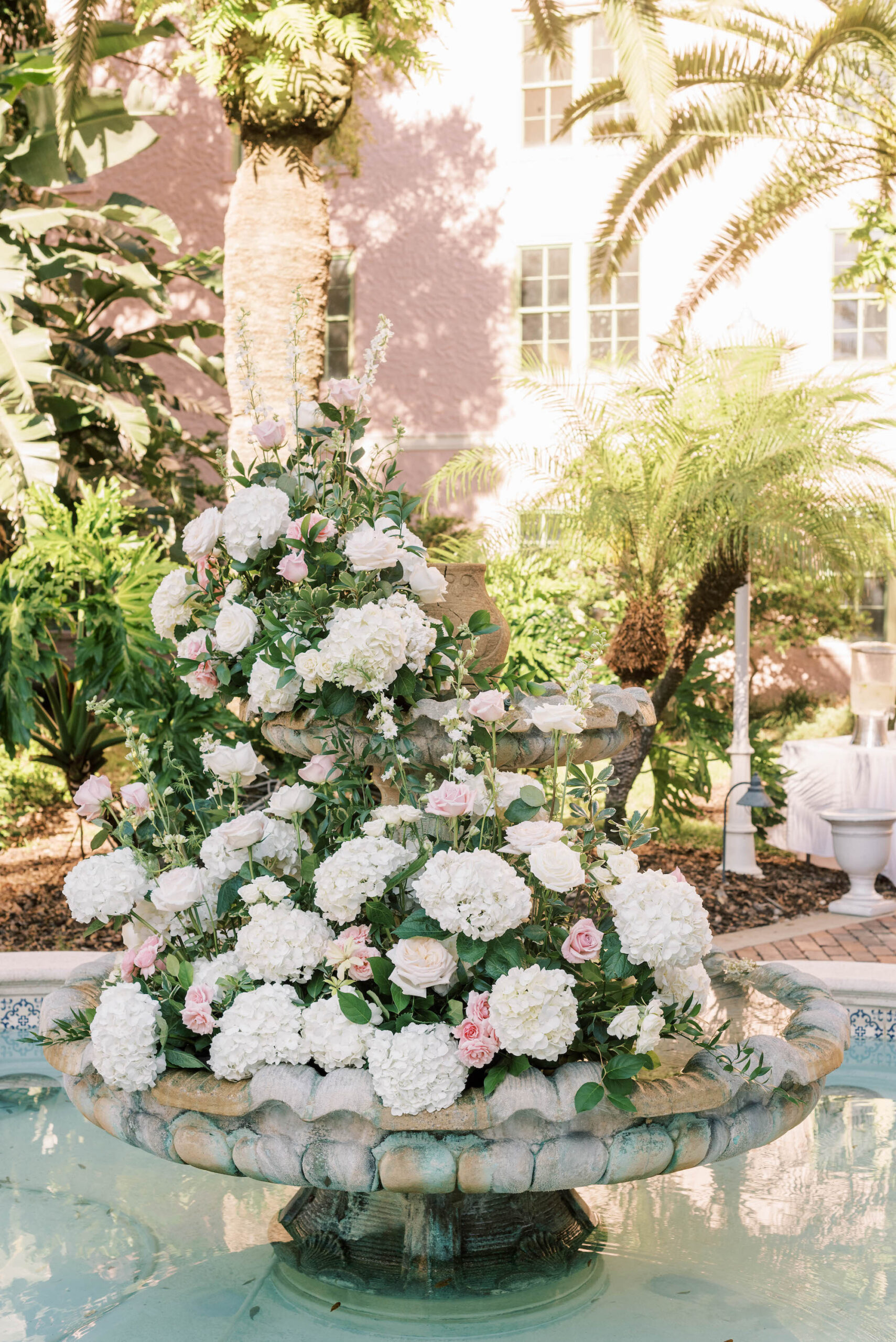 White Hydrangea and Pink Rose Fountain Flower Arrangement Decor Inspiration for Old Florida Tea Garden Wedding Ceremony Ideas